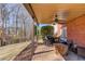 Covered patio with brick flooring, seating, and grill perfect for outdoor entertaining at 1175 Lamont Cir, Dacula, GA 30019
