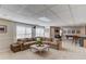 Finished basement with a large sectional couch and an entertainment area at 1175 Lamont Cir, Dacula, GA 30019