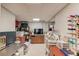 Well-organized basement featuring a TV, storage, and crafting equipment at 1175 Lamont Cir, Dacula, GA 30019
