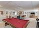 Spacious basement features a pool table, bar with seating, and comfortable entertainment area at 1175 Lamont Cir, Dacula, GA 30019