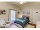 Cozy bedroom with a comfortable bed, chair and plenty of natural light at 1175 Lamont Cir, Dacula, GA 30019
