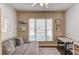 A versatile bedroom or flex space with ample natural light and a comfortable seating area at 1175 Lamont Cir, Dacula, GA 30019