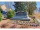 Hamilton Mill at Lakeforest community sign surrounded by flowers and greenery at 1175 Lamont Cir, Dacula, GA 30019