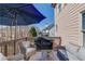Relaxing outdoor deck space featuring comfortable seating and shade umbrella with pleasant views at 1175 Lamont Cir, Dacula, GA 30019