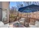 Outdoor deck with comfortable seating and views of the surrounding yard and woods at 1175 Lamont Cir, Dacula, GA 30019