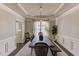 Elegant dining room featuring tray ceilings, decorative curtains, and a spacious dining table at 1175 Lamont Cir, Dacula, GA 30019