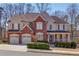 Charming two-story home featuring a brick facade, two-car garage, and inviting front porch at 1175 Lamont Cir, Dacula, GA 30019
