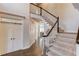 Grand foyer featuring staircase and hardwood flooring at 1175 Lamont Cir, Dacula, GA 30019