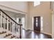Bright and airy foyer boasts hardwood floors, high ceilings, and a welcoming atmosphere at 1175 Lamont Cir, Dacula, GA 30019