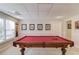 This game room features a beautiful pool table with a bright red felt top at 1175 Lamont Cir, Dacula, GA 30019