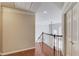 Hallway featuring gleaming hardwood floors and natural light at 1175 Lamont Cir, Dacula, GA 30019