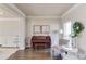 Inviting living room with hardwood floors, neutral walls, and a classic piano at 1175 Lamont Cir, Dacula, GA 30019