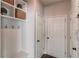 Mudroom with custom shelving, hooks and a bench seating area at 1175 Lamont Cir, Dacula, GA 30019