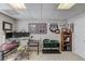 Bright home office featuring multiple monitors, sports memorabilia, and comfortable seating at 1175 Lamont Cir, Dacula, GA 30019