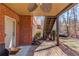 Brick patio with outdoor ceiling fan, leads to the stairs and backyard at 1175 Lamont Cir, Dacula, GA 30019