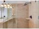 Tiled walk-in shower features a rainfall shower head, handheld sprayer, and a corner shelf at 1175 Lamont Cir, Dacula, GA 30019