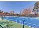 Brightly lit community tennis court for the enjoyment of residents looking for sports and recreational activities at 1175 Lamont Cir, Dacula, GA 30019