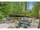 Charming backyard patio area surrounded by beautiful lush greenery at 1959 Grand Prix Ne Dr, Atlanta, GA 30345
