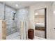 Beautifully tiled walk-in shower with glass partition and access to the main bedroom at 1959 Grand Prix Ne Dr, Atlanta, GA 30345