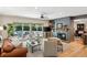 Inviting living room with ample natural light, fireplace, and an entertainment center at 1959 Grand Prix Ne Dr, Atlanta, GA 30345