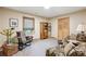 Cozy sitting room with large window, comfortable seating and natural light at 1959 Grand Prix Ne Dr, Atlanta, GA 30345