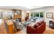 Comfortable living room featuring skylights, a stone fireplace, and large sliding glass doors at 1959 Grand Prix Ne Dr, Atlanta, GA 30345
