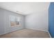 Light-filled bedroom with neutral carpet and a large window at 5589 Trace Views Dr, Norcross, GA 30071