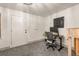 Home office featuring neutral walls, carpeting, and a modern desk setup at 651 Park Village Ne Dr, Atlanta, GA 30306