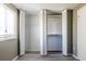 Bedroom featuring a wall of closet doors, natural light from a window, and wood-look floors for a functional space at 845 Regal Path Ln, Decatur, GA 30030
