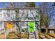 Charming townhome featuring a bright green front door and manicured front yard at 845 Regal Path Ln, Decatur, GA 30030
