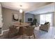 Living room features modern decor, dining table and chairs, and a cozy sofa, virtually staged at 845 Regal Path Ln, Decatur, GA 30030