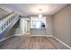 Living room featuring a view to the kitchen, hardwood floors and staircase at 845 Regal Path Ln, Decatur, GA 30030