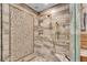 Beautifully tiled walk-in shower with a rainfall showerhead and a built-in bench, complemented by sleek glass doors at 1233 Poplar Grove Ne Dr, Atlanta, GA 30306
