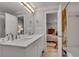 Modern bathroom featuring a double sink vanity with a white countertop, and a large mirror at 1233 Poplar Grove Ne Dr, Atlanta, GA 30306
