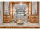Stylish bathroom vanity with granite countertop, vessel sink, wood cabinets and modern lighting fixtures at 1233 Poplar Grove Ne Dr, Atlanta, GA 30306