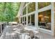 Inviting deck with multiple seating areas and tree view at 1233 Poplar Grove Ne Dr, Atlanta, GA 30306