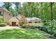 Charming home with well-manicured lawn and mature landscaping at 1233 Poplar Grove Ne Dr, Atlanta, GA 30306