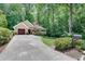Well-maintained home with long driveway, lush landscaping, and mailbox at 1233 Poplar Grove Ne Dr, Atlanta, GA 30306