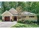 Beautiful single-story home with lush landscaping and curb appeal at 1233 Poplar Grove Ne Dr, Atlanta, GA 30306