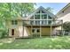 Rear exterior view of house with deck and walkout basement at 1233 Poplar Grove Ne Dr, Atlanta, GA 30306