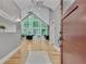 Grand foyer with soaring ceilings, hardwood floors, and expansive windows overlooking lush greenery at 1233 Poplar Grove Ne Dr, Atlanta, GA 30306