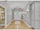 Elegant foyer with recessed lights, light wood floors, and white trim at 1233 Poplar Grove Ne Dr, Atlanta, GA 30306