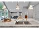 Modern kitchen island with stainless steel sink and seating, open to the living room at 1233 Poplar Grove Ne Dr, Atlanta, GA 30306