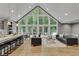 Open-concept living area features hardwood floors, vaulted ceilings and large windows at 1233 Poplar Grove Ne Dr, Atlanta, GA 30306