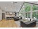 Open-concept living area features hardwood floors, vaulted ceilings and large windows at 1233 Poplar Grove Ne Dr, Atlanta, GA 30306