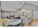 Open-concept living area features hardwood floors, vaulted ceilings and large windows at 1233 Poplar Grove Ne Dr, Atlanta, GA 30306