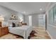 Comfortable bedroom with hardwood floors, a queen-size bed, and a view of the walk-in closet at 1233 Poplar Grove Ne Dr, Atlanta, GA 30306