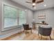 Bright home office featuring hardwood floors, a ceiling fan, a large window, and comfortable seating at 1233 Poplar Grove Ne Dr, Atlanta, GA 30306