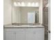 Bathroom features granite countertops with double sinks, vanity, and a tiled walk-in shower, creating a functional and stylish space at 1829 Hislop Ln, Atlanta, GA 30345