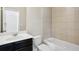 Bathroom featuring a shower, and a single sink vanity, providing a practical and functional space at 1829 Hislop Ln, Atlanta, GA 30345